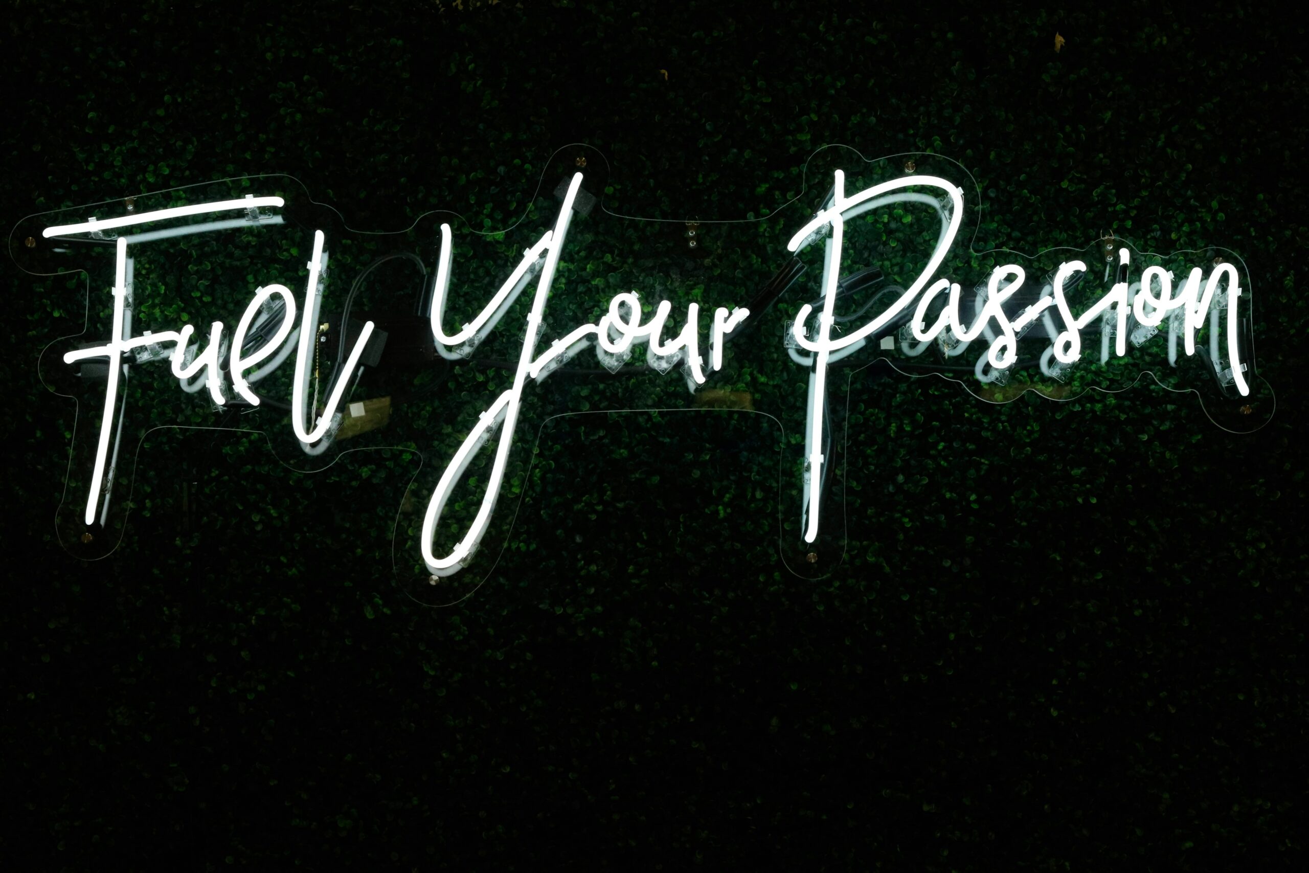 neon sign reading "fuel your passion"